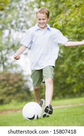 Young Boy Playing Soccer