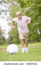 Young Boy Playing Soccer