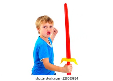 A young boy playing with sword on a white background