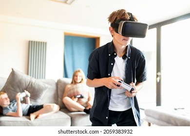 Young boy playing VR game at home - Powered by Shutterstock