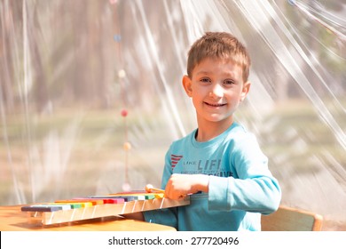 Young Boy Playing Xylophone