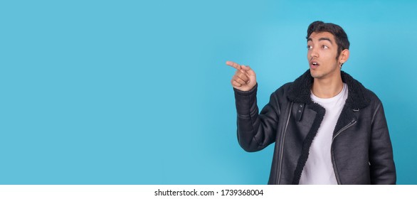 young boy pointing isolated on background with space - Shutterstock ID 1739368004