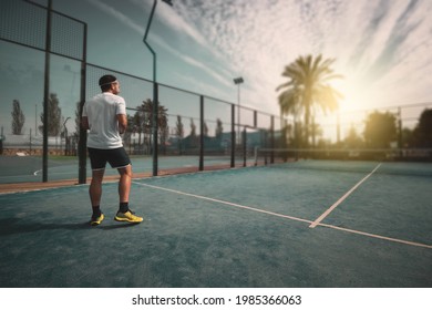 A Young Boy Posing On An Outdoor Sports Court