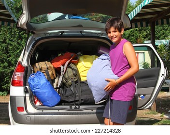 Young Boy With Purple Shirt Car Baggage Charge Before Departure