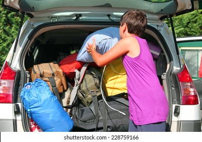 Young Boy With Purple Shirt Car Baggage Charge Before Departure