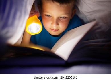 690 Boy reading under covers Images, Stock Photos & Vectors | Shutterstock