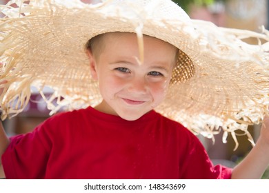 Young Boy In Red Shirt, With Large Sun Hat
