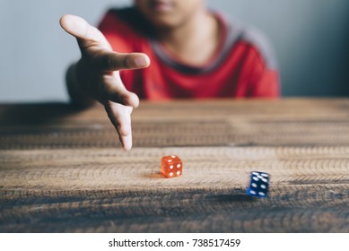 Young Boy Rolling / Throwing A Dice