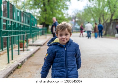 Young Boy Running Towards The Camera