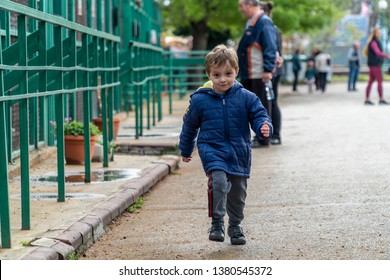 Young Boy Running Towards The Camera