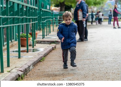 Young Boy Running Towards The Camera