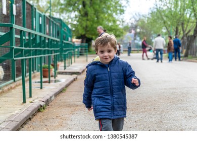 Young Boy Running Towards The Camera