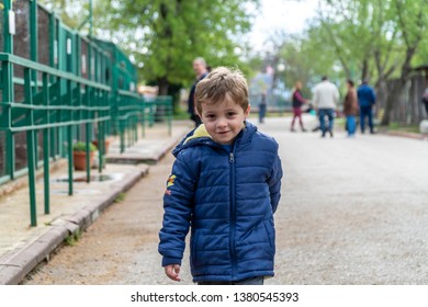 Young Boy Running Towards The Camera