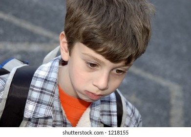 Young Boy With Serious Looking Expression