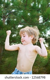 Young Boy Showing His Muscles