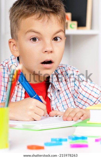 Young Boy Sitting Desk Classroom Doing Stock Photo 215978263 Shutterstock