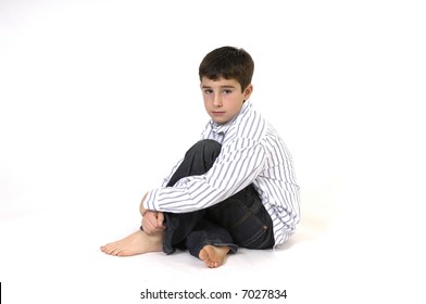 Young boy sitting looking at camera