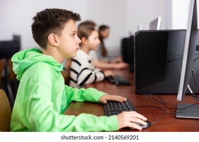 Young Boy Sitting Table Using Computer Stock Photo 2140569201 ...