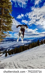 Young Boy Ski Jumping At Jackson Hole Resort, Wyoming, USA