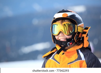 A Young Boy Skier In His Snow Gear.