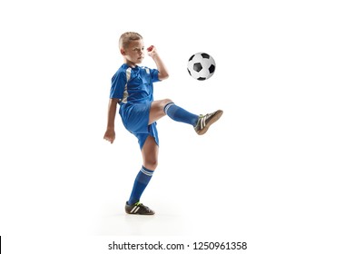 Young Boy With Soccer Ball Doing Flying Kick, Isolated On White. Football Soccer Players In Motion On Studio Background. Fit Jumping Boy In Action, Jump, Movement At Game.