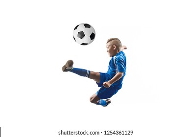 Young Boy With Soccer Ball Doing Flying Kick, Isolated On White. Football Soccer Players In Motion On Studio Background. Fit Jumping Boy In Action, Jump, Movement At Game.