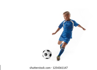 Young Boy With Soccer Ball Doing Flying Kick, Isolated On White. Football Soccer Players In Motion On Studio Background. Fit Jumping Boy In Action, Jump, Movement At Game.