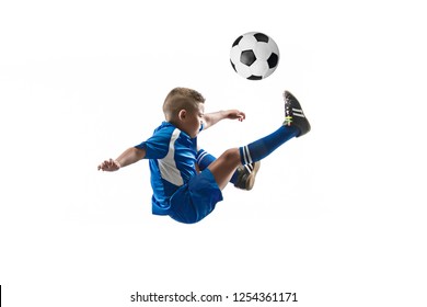 Young Boy With Soccer Ball Doing Flying Kick, Isolated On White. Football Soccer Players In Motion On Studio Background. Fit Jumping Boy In Action, Jump, Movement At Game.