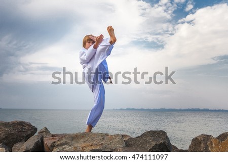 Young boy training karate