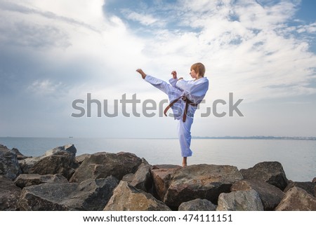 Young boy training karate