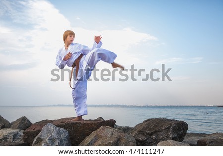Young boy training karate