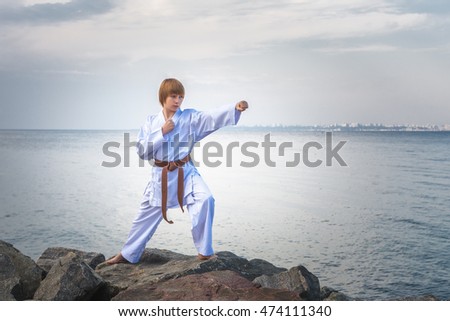 Young boy training karate