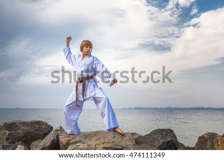 Young boy training karate