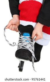 Young Boy Tying His Ice Skates In Hockey Uniform