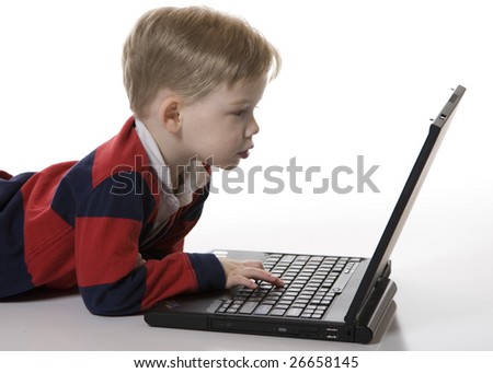 Young Boy Typing on the Computer