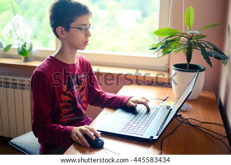 Young boy using laptop