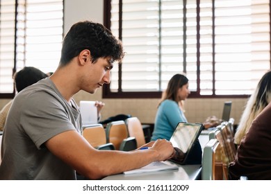Young boy using a tablet in class