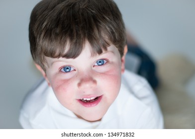 Young Boy Watches Television/computer With Glow From Screen On His Face