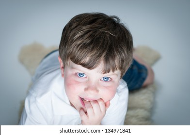 Young Boy Watches Television/computer With Glow From Screen On His Face