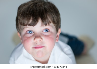 Young Boy Watches Television/computer With Glow From Screen On His Face