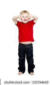 Young boy wearing jeans and a red T-shirt stood isolated on a white background looking into the camera putting his thumbs down