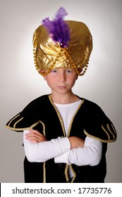 Young Boy Wearing A Sultan Or Sheik's Halloween Costume
