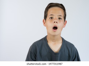 Young Boy Whistling And Looking To The Camera