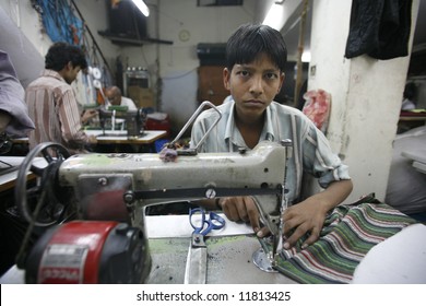 Young Boy Working In Delhi Textile Factory, India