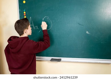 Young Boy Writing on Chalkboard, Education, Learning, Classroom, School, Child, Knowledge, Penmanship, Academic, Study, Student