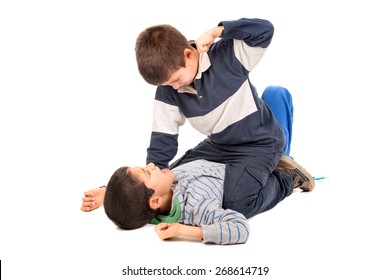 Young boys fighting isolated in white