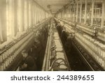 Young boys and girls working in the spinning room of the Cornell Mill in Fall River, Massachusetts. January 1912 photo by Lewis Hine.