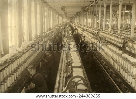 Young boys and girls working in the spinning room of the Cornell Mill in Fall River, Massachusetts. January 1912 photo by Lewis Hine.