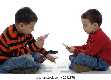 Young Boys Playing Cards Against White