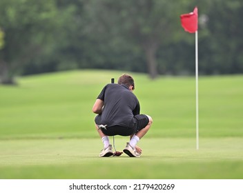 Young boys playing golf in a competitive tournament